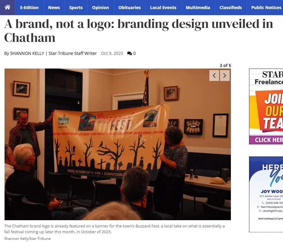 A screenshot of the article, including a photo of two people holding up a large banner for Buzzard Fest 2025 in a meeting room.